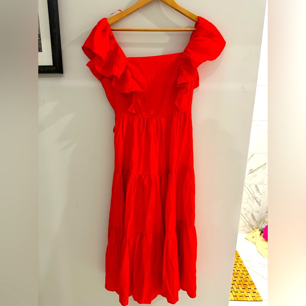 A. calin by flying tomatoe dress. MIDI length. Beautiful tie in back.